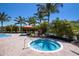 Relax at the community spa surrounded by lush tropical landscaping and palm trees, perfect for unwinding at 8191 Gabanna Dr, Sarasota, FL 34231