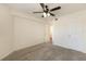 Bedroom with a neutral carpet, ceiling fan, and two doors at 850 S Tamiami Trl # 203, Sarasota, FL 34236
