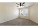 Bedroom with a neutral carpet, ceiling fan, and a window at 850 S Tamiami Trl # 203, Sarasota, FL 34236
