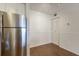 Bright dining room with wood floors, and stainless steel refrigerator at 850 S Tamiami Trl # 203, Sarasota, FL 34236