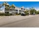 Well maintained condo complex with multiple units, landscaping, and ample parking at 850 S Tamiami Trl # 203, Sarasota, FL 34236