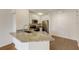 Close-up of a kitchen with granite countertops, stainless steel appliances, and white cabinets at 850 S Tamiami Trl # 203, Sarasota, FL 34236