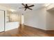Spacious living area with hardwood floors, view of kitchen and neutral wall paint at 850 S Tamiami Trl # 203, Sarasota, FL 34236