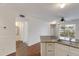 Bright living room featuring wood floors, and view of the kitchen island with granite counter at 850 S Tamiami Trl # 203, Sarasota, FL 34236