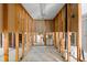 Unfinished basement space featuring exposed wood framing, pipes, and concrete floor at 868 Siesta Key Cir, Sarasota, FL 34242