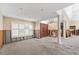 Elegant entrance featuring a double door and columns under renovation with abundant natural light at 868 Siesta Key Cir, Sarasota, FL 34242