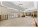 Bright, spacious living area with shuttered doors leading to the outside and an open layout being renovated at 868 Siesta Key Cir, Sarasota, FL 34242