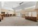 Bright living room with high ceilings and shuttered doors leading to the outside, ready for renovation at 868 Siesta Key Cir, Sarasota, FL 34242