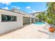 Private backyard featuring a refreshing swimming pool and spacious patio perfect for outdoor entertaining at 868 Siesta Key Cir, Sarasota, FL 34242