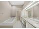 Large bathroom features double sinks, spacious tub and a separate shower; bright with lots of counter space at 4517 Las Brisas Ln, Sarasota, FL 34238