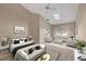 Bright bedroom boasts neutral walls, ceiling fan, skylight, and open seating area for relaxing or reading a good book at 4517 Las Brisas Ln, Sarasota, FL 34238