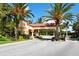 Community entrance gate with mature landscaping and paver entry at 4517 Las Brisas Ln, Sarasota, FL 34238