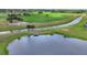 Scenic golf course and lake views with lush greenery and abundant birdlife at 4517 Las Brisas Ln, Sarasota, FL 34238