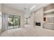Open living area with fireplace, wet bar, and access to the screened lanai at 4517 Las Brisas Ln, Sarasota, FL 34238