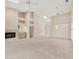 Spacious living room with a fireplace, wet bar, and stylish chandelier at 4517 Las Brisas Ln, Sarasota, FL 34238