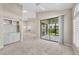 Open living area with fireplace, wet bar, access to screened lanai and views into other living spaces at 4517 Las Brisas Ln, Sarasota, FL 34238