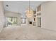 Open living room featuring a fireplace, sliding glass doors, and vaulted ceilings at 4517 Las Brisas Ln, Sarasota, FL 34238