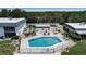 Aerial view of community pool and patio with boat docks and waterfront views at 10423 Waterbird Way # 10423, Bradenton, FL 34209