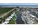 Stunning aerial view of waterfront homes with boat docks and backyard canals, situated in a coastal community at 10423 Waterbird Way # 10423, Bradenton, FL 34209