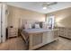 Cozy bedroom with a woven-accent bed frame, matching nightstands, and a light, neutral color palette at 10423 Waterbird Way # 10423, Bradenton, FL 34209