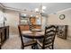 Comfortable dining room providing views of the kitchen and an adjacent doorway at 10423 Waterbird Way # 10423, Bradenton, FL 34209
