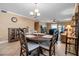 Inviting dining area showing the living room in the background at 10423 Waterbird Way # 10423, Bradenton, FL 34209