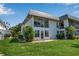 Charming condo with a screened lanai, lush lawn, and landscaping providing a relaxing outdoor space at 10423 Waterbird Way # 10423, Bradenton, FL 34209
