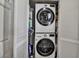 Laundry closet with a stacked washer and dryer at 10423 Waterbird Way # 10423, Bradenton, FL 34209