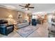 Inviting living room featuring tile floors, comfortable seating, and an open layout to the dining area at 10423 Waterbird Way # 10423, Bradenton, FL 34209