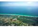 An aerial view showcases Pine Run's proximity to the ocean and its coastal location at 107 Woodland Pl # 107, Osprey, FL 34229