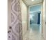 Bathroom doorway with access to a bedroom and hallway closet at 107 Woodland Pl # 107, Osprey, FL 34229