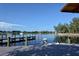 A scenic dock offers waterfront relaxation and boat access in a tranquil setting at 107 Woodland Pl # 107, Osprey, FL 34229