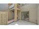 Condo featuring a private entrance with a combination of wood deck and rock garden at 107 Woodland Pl # 107, Osprey, FL 34229