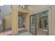 Condo featuring a private entrance with a combination of brick, rock, and wood flooring at 107 Woodland Pl # 107, Osprey, FL 34229