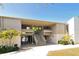 Exterior shot of building; stairs lead up to units on the second floor at 107 Woodland Pl # 107, Osprey, FL 34229