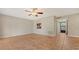 Bright living area with tile flooring and a ceiling fan, move-in ready at 107 Woodland Pl # 107, Osprey, FL 34229