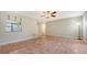 Open living room with tile floors, offering a great space to relax and entertain at 107 Woodland Pl # 107, Osprey, FL 34229