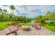 Outdoor gathering area with comfortable seating and a tranquil water view at 107 Woodland Pl # 107, Osprey, FL 34229