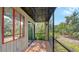 Cozy screened patio featuring tile floor, a delightful outdoor living area at 107 Woodland Pl # 107, Osprey, FL 34229