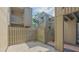 This home features a private outdoor patio with wood flooring and fenced in privacy at 107 Woodland Pl # 107, Osprey, FL 34229