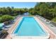 Beautiful pool and deck area overlooking serene waterway; perfect for relaxation and outdoor enjoyment at 107 Woodland Pl # 107, Osprey, FL 34229