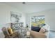 Cozy living room featuring stylish furniture and sliding glass doors to the backyard at 1074 Bristol St, Port Charlotte, FL 33952