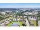 Wide aerial shot displays the community's lush landscaping, several serene ponds, and well-maintained homes at 11507 84Th Street E Cir # 102, Parrish, FL 34219