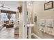 Half bathroom featuring a pedestal sink and decorative seashell-themed towels and art at 11507 84Th Street E Cir # 102, Parrish, FL 34219