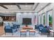 Inviting clubhouse lounge area with comfortable seating, a large TV, and convenient access to the kitchen at 11507 84Th Street E Cir # 102, Parrish, FL 34219