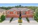 A stunning exterior view of the townhomes and a beautiful manicured lawn at 11507 84Th Street E Cir # 102, Parrish, FL 34219