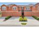 Attractive townhome boasts a private garage, tasteful landscaping, and a clean, modern facade at 11507 84Th Street E Cir # 102, Parrish, FL 34219