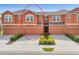 Charming townhome featuring a well-manicured lawn and a two-car garage at 11507 84Th Street E Cir # 102, Parrish, FL 34219
