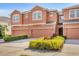 Inviting townhome with a two-car garage and a colorful, well-maintained garden at 11507 84Th Street E Cir # 102, Parrish, FL 34219