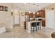Modern kitchen with stainless steel appliances, granite countertops, and a breakfast bar at 11507 84Th Street E Cir # 102, Parrish, FL 34219